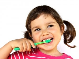 Young girl brushing her teeth