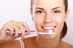 Woman brushing teeth